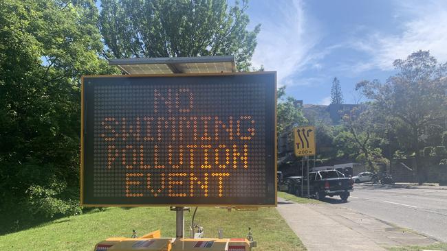 A sign on New South Head Road warns beachgoers not to swim at Redleaf Beach in Double Bay.