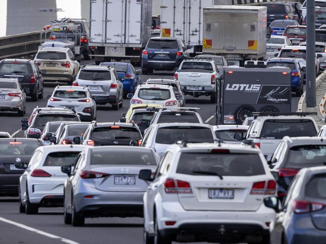 MELBOURNE, OCTOBER 29, 2021: Traffic is banked up heading onto the West Gate Bridge on Friday afternoon as Melburnians are able to travel to regional Victoria after lockdown restrictions eased.Picture: David Geraghty