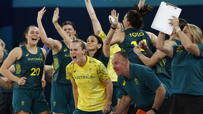 Members of the Opals team celebrate after claiming bronze with a win over Belgium on Sunday night. Picture: Reuters