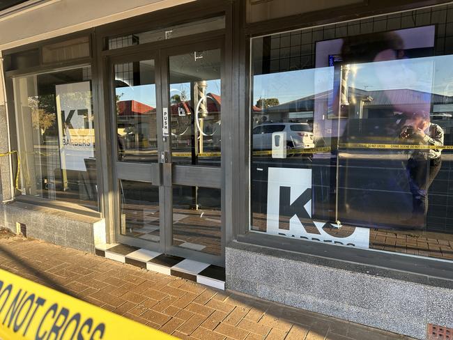 A business in Adelaide’s western suburbs has been the target of a drive-by shooting with police confirming shots were fired at a building on Thursday night., , Police were called to a business – believed to be a barber shop – on Hawson Ave after reports of the gunshots just before 9.30pm., , It is understood at least five rounds had been fired into the door. Picture: Sam Lowe