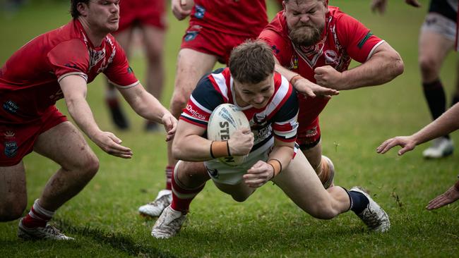 Sebastian Plaister dives over to score. Picture: Julian Andrews