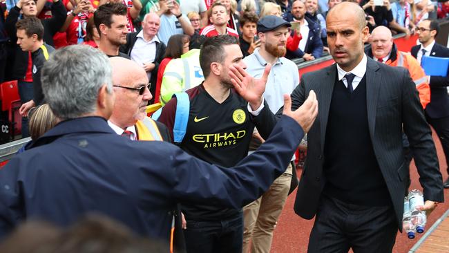 Jose Mourinho, Manager of Manchester United (L) annd Josep Guardiola, Manager of Manchester City.