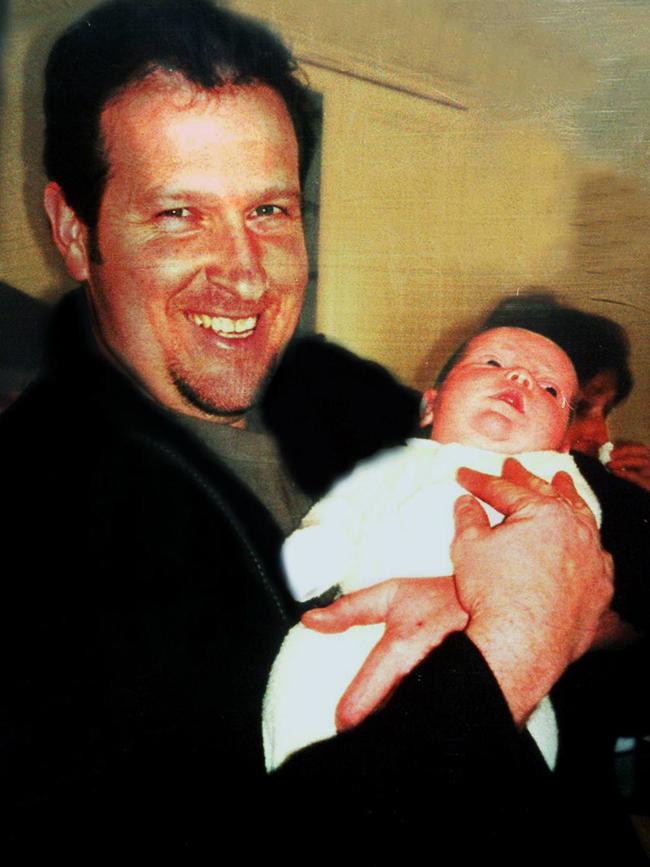 Senior Constable Rod Miller with infant baby son Jimmy.