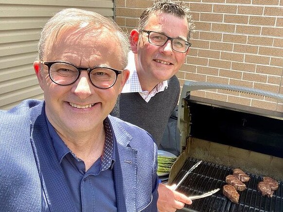 Anthony Albanese and Daniel Andrews enjoying a barbecue together.