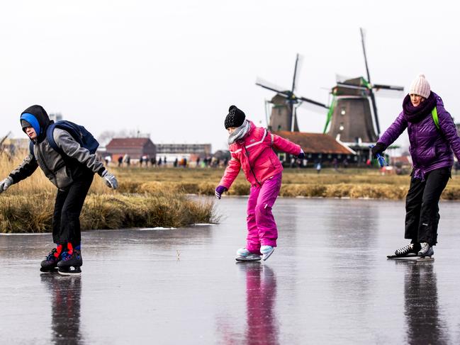Ice skaters skate on natural ice at the Dutch ‘Zaanse Schans’ near Zaandam on March 1, 2018. Heavy snowfall and deadly blizzards lashed Europe, forcing airports to cancel or delay flights around the continent, as a deep freeze gripped countries from the far north to the Mediterranean beaches in the south. Picture: AFP