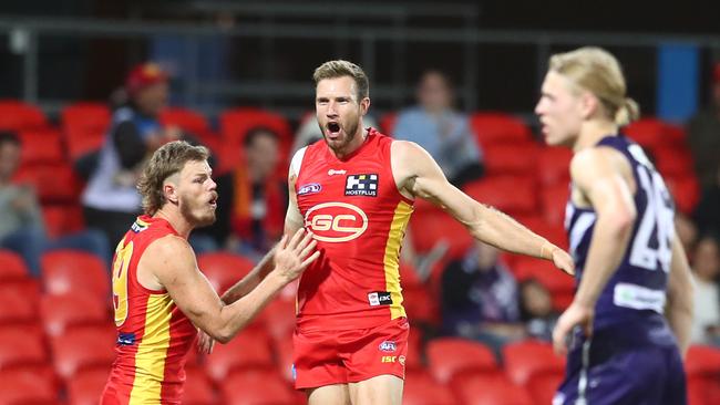 Sam Day of the Suns celebrates a goal during the round 4 AFL match between the Gold Coast Suns and Fremantle Dockers at Metricon Stadium on June 27, 2020 in Gold Coast, Australia. (Photo by Chris Hyde/Getty Images)