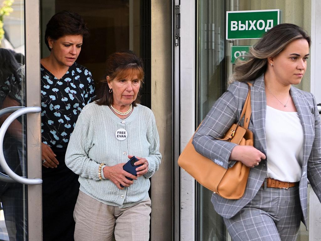 Evan Gershkovich’s mother Ella Milman leaves a Moscow court flanked by his legal team. Picture: Natalia Kolesnikova (AFP)