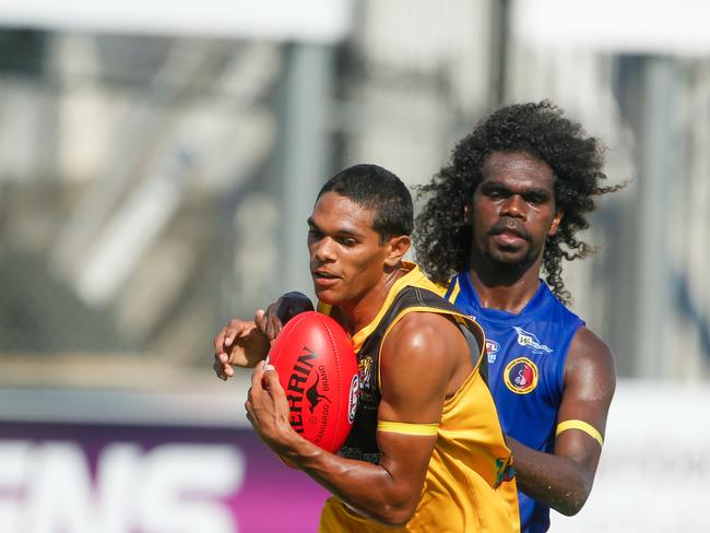 Tigers Kaine Riley and wanderers Dray Thompson as Nightcliff V Wanderers at TIO Stadium. Picture GLENN CAMPBELL