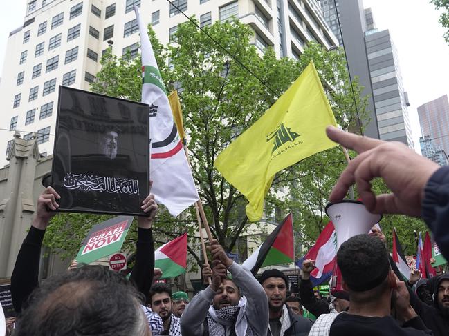 Protesters carry the photo of assassinated Hezbollah leader Hassan Nasrallah. Picture: NCA NewsWire