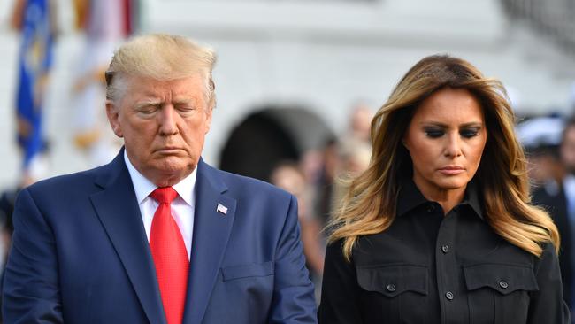 Donald and Melania Trump observe a moment of silence on the South Lawn of the White House to mark the 18th anniversary of the 9/11 attacks. Picture: AFP
