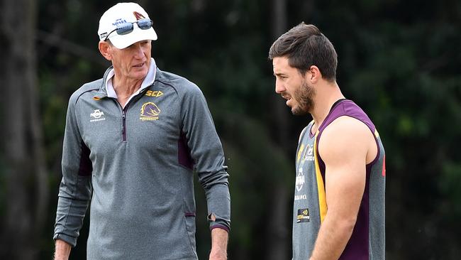 Coach Wayne Bennett talks to Ben Hunt during Broncos training session.