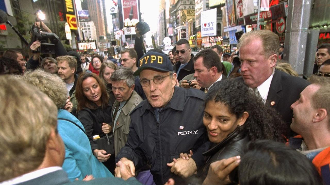 Mayor Rudy Giuliani walks through Times Square two days before 9/11. Picture: Craig T. Warga/AP