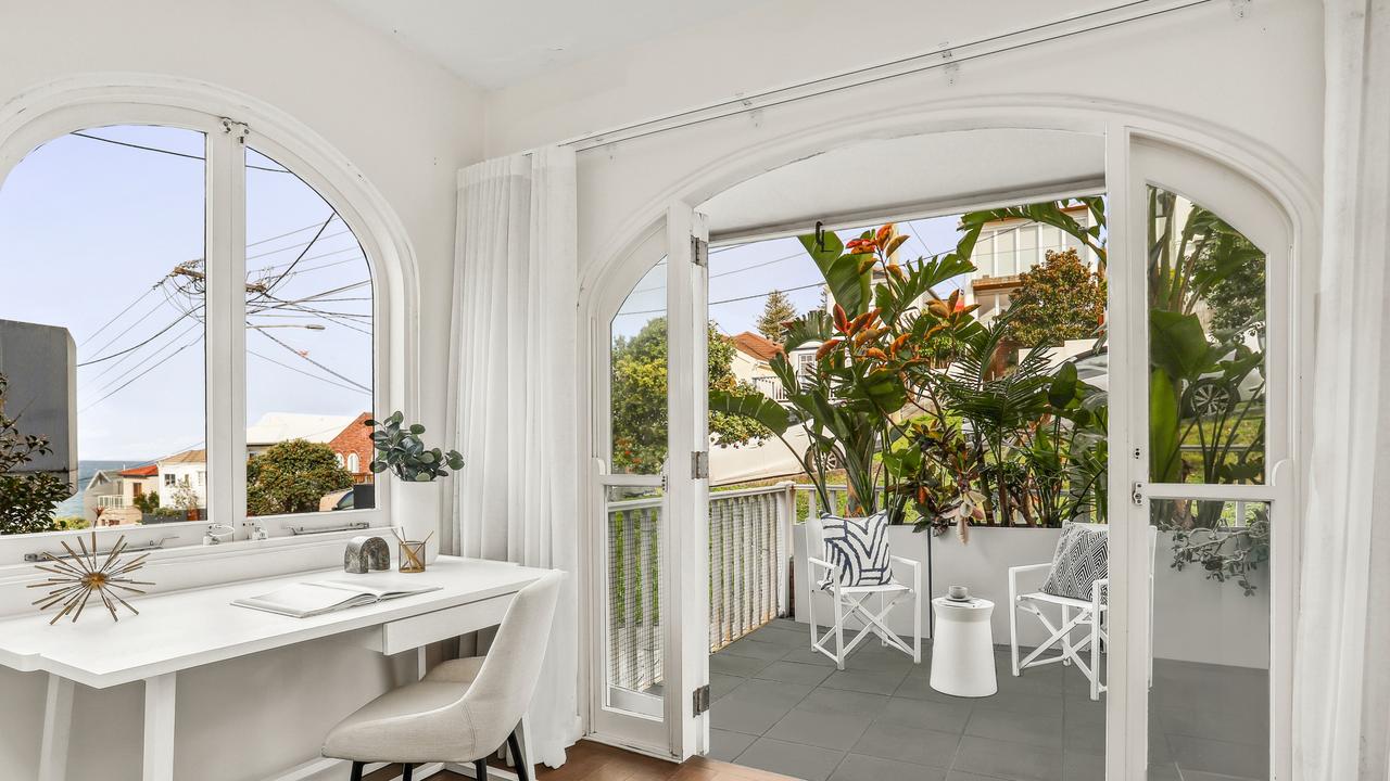 The sunroom opens to a large entertainment terrace.