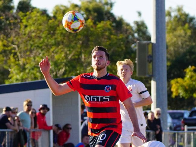 Nerang Eagles number 10, Luke Marsh, juggles his way through a scrambling Bureligh Heads defense and his pivotal performance to bag a goal and assist in the Eagle 4-1 thumping of the defending champions at Nerang on Sunday. Photo: Luke Sorensen.