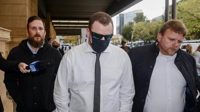 Daniel Liddell leaves the District Court flanked by supporters. Photo: NCA NewsWire / Brenton Edwards