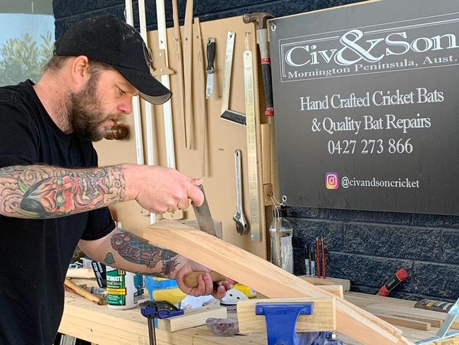 Adam Ciavarella works on a bat in his Rosebud carport.