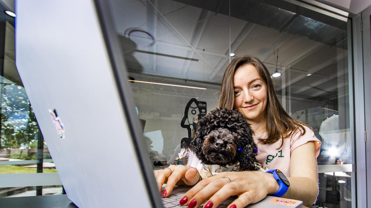 Heather Morgan, with her dog Brena, at Go1 where she’s made the switch to the tech sector. Picture: Nigel Hallett