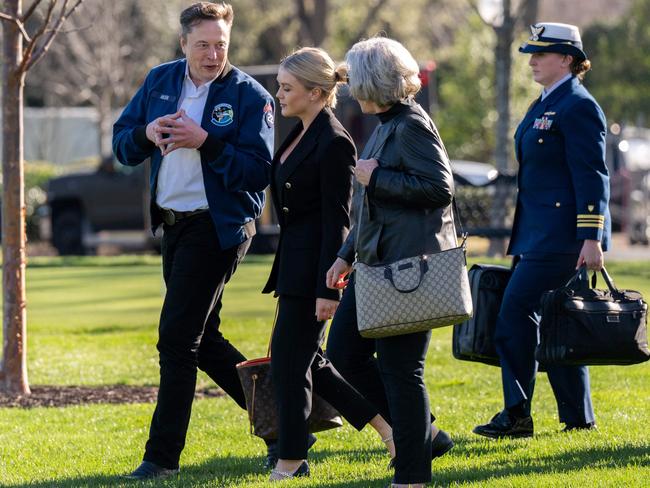 Elon Musk with White House press secretary Karoline Leavitt and chief of staff Susie Wiles leaving for Air Force One on Friday. Picture: Annabelle Gordon / AFP