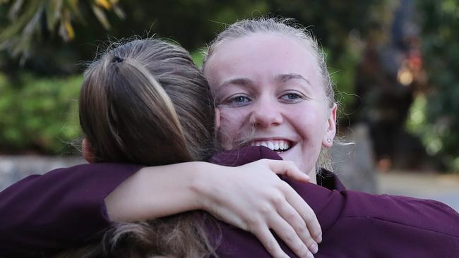 Commonwealth Games gold medalist Ariarne Titmus congratulated bt a friend at St Peters.