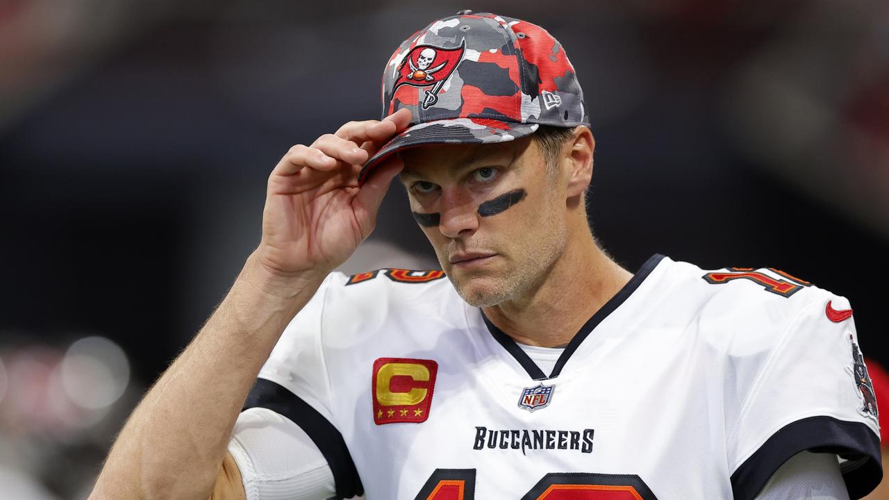 ATLANTA, GEORGIA - JANUARY 08: Tom Brady #12 of the Tampa Bay Buccaneers walks to the locker room at halftime during the game against the Atlanta Falcons at Mercedes-Benz Stadium on January 08, 2023 in Atlanta, Georgia. (Photo by Todd Kirkland/Getty Images)