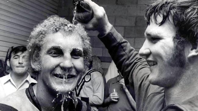 Jeff Fyfe is doused with beer by Valleys forward Russell Hughes who called in to congratulate the winners.