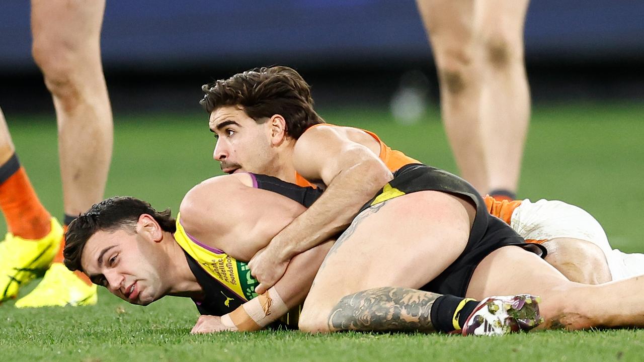 MELBOURNE, AUSTRALIA – JULY 14: Tim Taranto of the Tigers is tackled by Toby Bedford of the Giants during the 2024 AFL Round 18 match between the Richmond Tigers and the GWS GIANTS at Melbourne Cricket Ground on July 14, 2024 in Melbourne, Australia. (Photo by Michael Willson/AFL Photos via Getty Images)