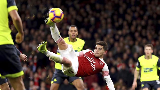 Arsenal's Lucas Torreira scores his side's first goal of the game  during the English Premier League soccer match between Arsenal and Huddersfield, at the Emirates Stadium, London, Saturday, Dec. 8, 2018. (Isabel Infantes/PA via AP)