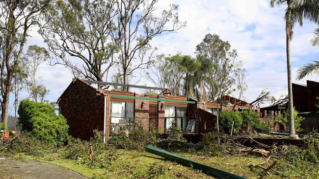 The roof is torn off a home at Tamworth Drive, as Helensvale was smashed by a ferocious storm in Christmas night leaving a trail of destruction and 1 woman losing het life. Pics Adam Head