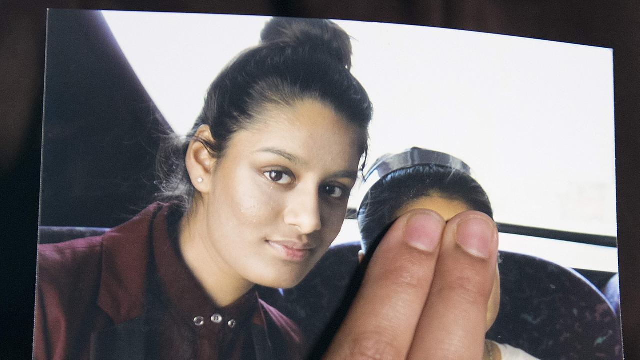 Renu Begum, eldest sister of Shamima Begum, holds a picture of her sister while being interviewed by the media in central London in 2015.