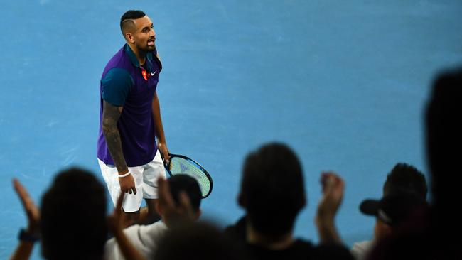 Fans cheer after Australia's Nick Kyrgios beat France's Ugo Humbert in their men's singles match on day three of the Australian Open tennis tournament in Melbourne on February 10, 2021. (Photo by William WEST / AFP) / — IMAGE RESTRICTED TO EDITORIAL USE – STRICTLY NO COMMERCIAL USE —