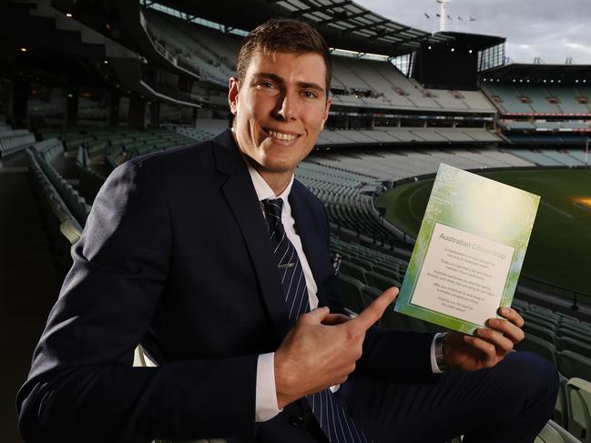 The Collingwood Football Club hosts a special Citizenship Ceremony at the MCG.  AFL player Mason Cox receives his certificate. Picture: Alex Coppel.