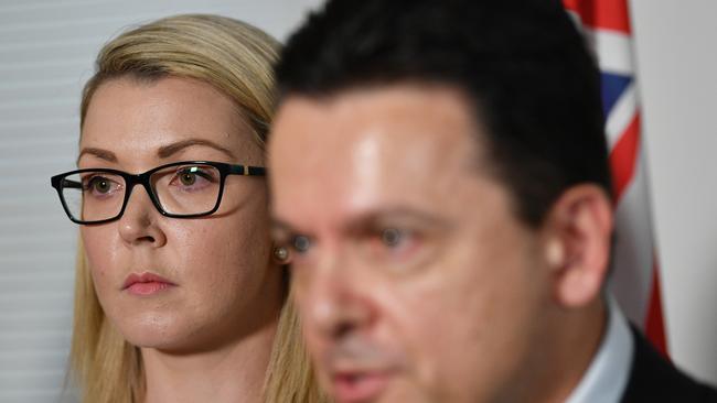 Nick Xenophon Team (NXT) Senator Skye Kakoschke-Moore (left) looks on after announcing her resignation, as Party Leader Nick Xenophon speaks. Picture: AAP.