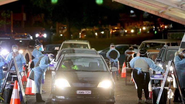 Long lines of cars queue up at the Merrylands COVID-19 testing site at Merrylands Park. Picture: Toby Zerna