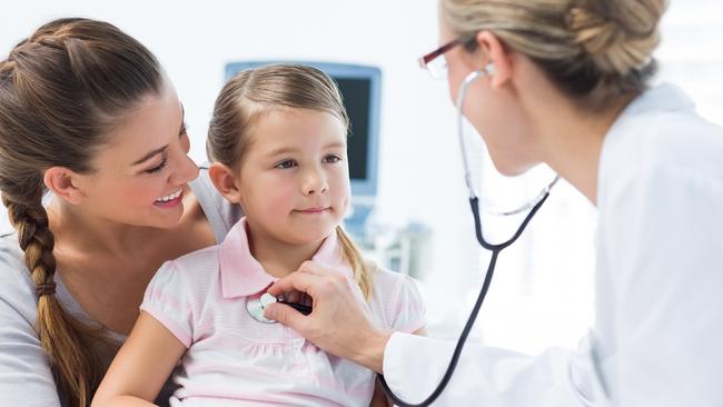 Girl being examined by female pediatrician
