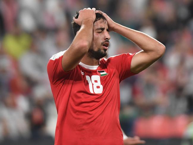 Palestine's midfielder Oday Dabbagh reacts after a missed shot during the 2019 AFC Asian Cup group B football match between Palestine and Jordan at the Mohammed Bin Zayed Stadium in Abu Dhabi on January 15, 2019. (Photo by Khaled DESOUKI / AFP)