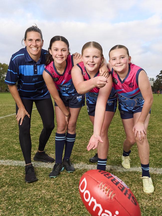 Crows star Chelsea Randall with Aayla Walker, 12, Abbey Bates, 11, and Violet Tulloch, 11 at the Glenunga Football Club. Picture: Matt Loxton