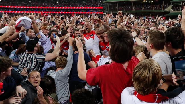 Lance Franklin celebrates with fans and teammates. Picture: Getty Images