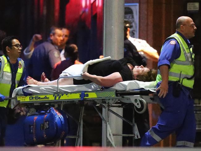 Louisa Hope is taken out of the Lindt Cafe on a stretcher after the hostage standoff. Pic: Joosep Martinson/Getty Images