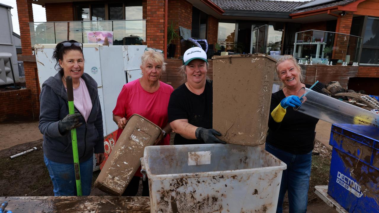 Julie Keegan, Sue Allport, Heidi Anderson and Deb Brown are typical of residents rallying together as the recovery effort begins. Picture: NewsWire / Scott Calvin