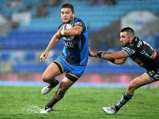 Titans player Ashley Taylor gets clear of Sharks player Jack Bird before scoring a try during the Round 19 NRL match between the Gold Coast Titans and the Cronulla Sharks at CBUS Stadium on the Gold Coast, Saturday, July 15, 2017. Picture: DAVE HUNT