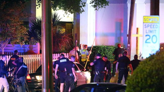 Trying to make sense of it ... Police stand outside the Emanuel AME Church. Picture: Wade Spees/The Post And Courier via AP