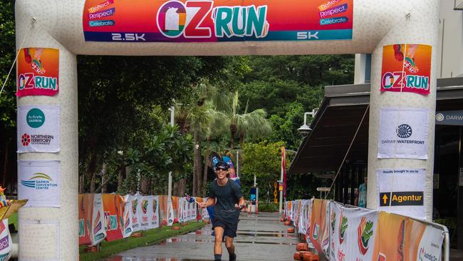 Liam Gotts was the first runner to cross the finish line at the annual Australia Day Oz Run at the Darwin Waterfront in 2023. Picture: Pema Tamang Pakhrin