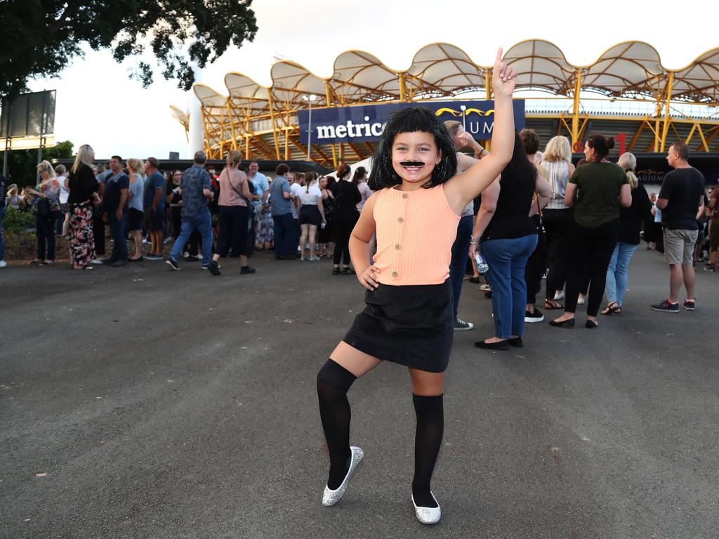 6-year-old Lucy Mcknight from Tamworth arrives at Metricon Stadium to see Queen Live. Photograph: Jason O'Brien