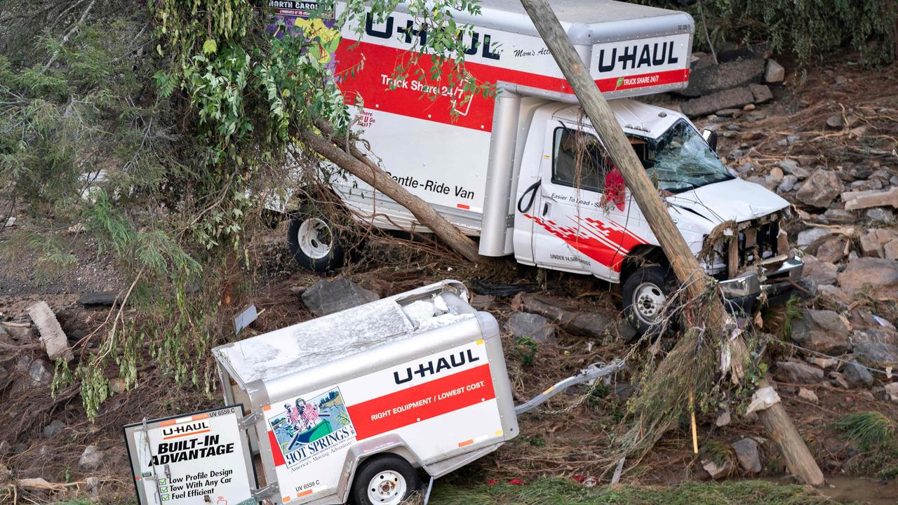 A storm-damaged U-Haul truck and trailer are seen in the aftermath of Hurricane Helene in Asheville, North Carolina, as the death toll rises. Picture: Getty Images via AFP