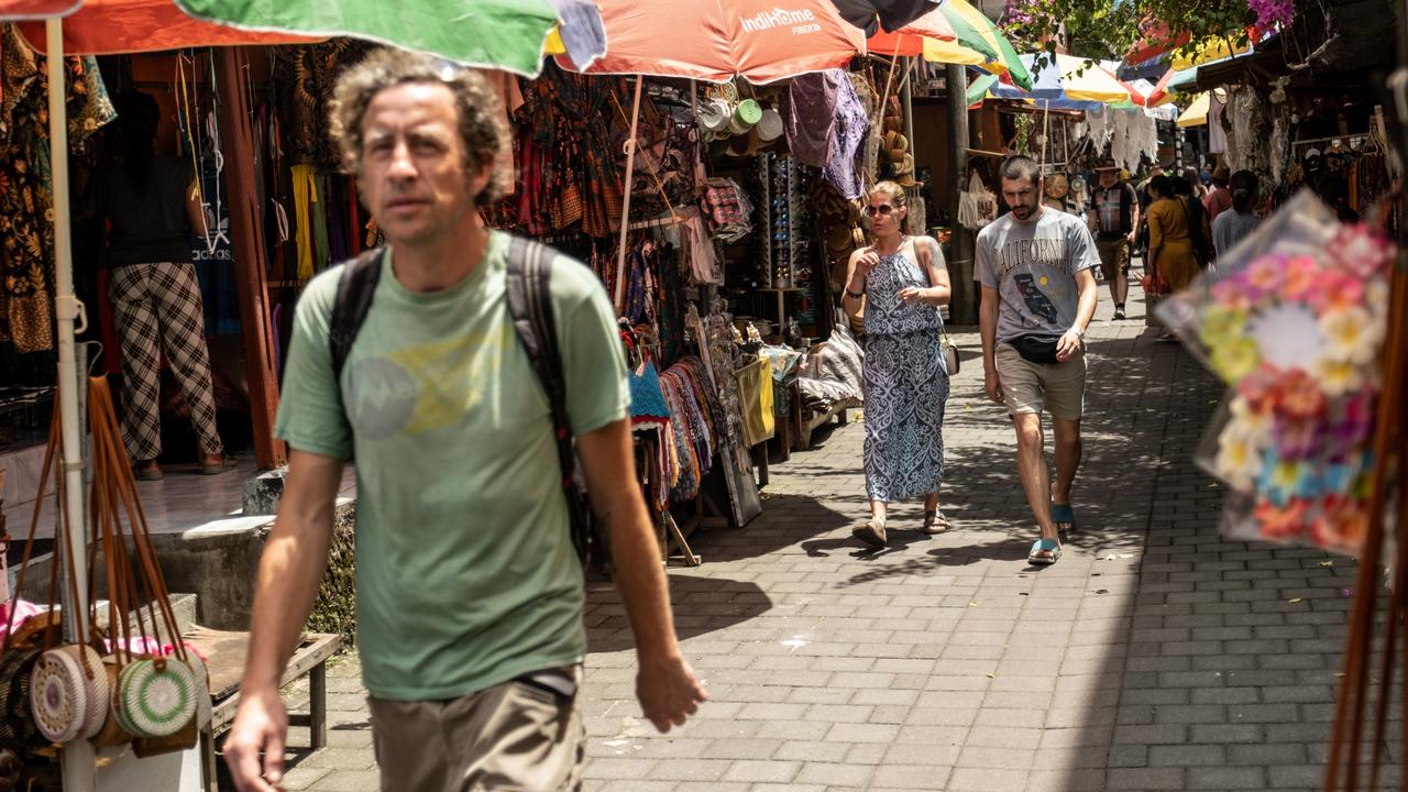 Tourists are recommended to change money at a bank, their hotel, or an authorised money-changing outlet displaying permits. Picture: Agung Parameswara/Getty Images