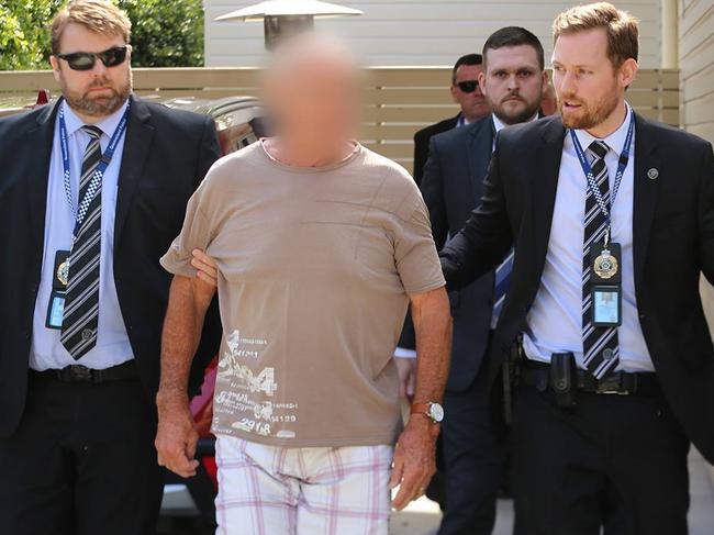 Chris Dawson is taken into custody this morning. Picture: NSW police