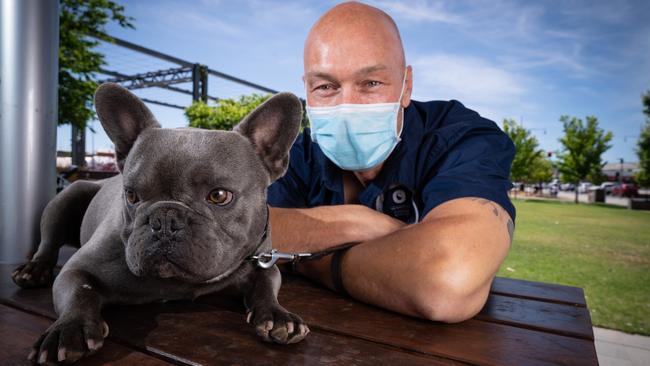 Wodonga VIC, AUSTRALIA – Herald Sun – November 18th, 2020: Jason Dowding and Hobbs the Frenchie bulldog in Wodonga were the face mask rule still applies. BYLINE – Simon Dallinger