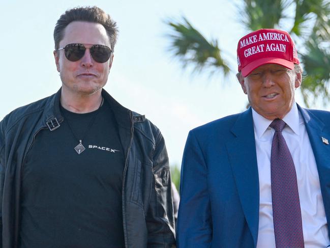 BROWNSVILLE, TEXAS - NOVEMBER 19: U.S. President-elect Donald Trump greets Elon Musk as he arrives to attend a viewing of the launch of the sixth test flight of the SpaceX Starship rocket on November 19, 2024 in Brownsville, Texas. SpaceXâs billionaire owner, Elon Musk, a Trump confidante, has been tapped to lead the new Department of Government Efficiency alongside former presidential candidate Vivek Ramaswamy.   Brandon Bell/Getty Images/AFP (Photo by Brandon Bell / GETTY IMAGES NORTH AMERICA / Getty Images via AFP)