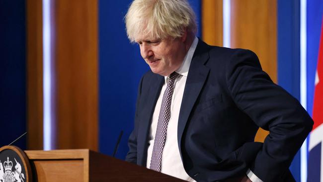 Prime Minister Boris Johnson announcing all air passengers will have to isolate until they show a negative Covid test results, after confirming two people in Britain have the new Omicron Covid strain. Picture: Hollie Adams / POOL / AFP