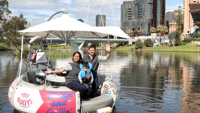 BBQ Buoys' Martin Kloeckner, with Andrea Escalante Padilla and their son, Emilio, says JobKeeper payments have helped keep their Adelaide tourism business afloat. Picture: Dean Martin